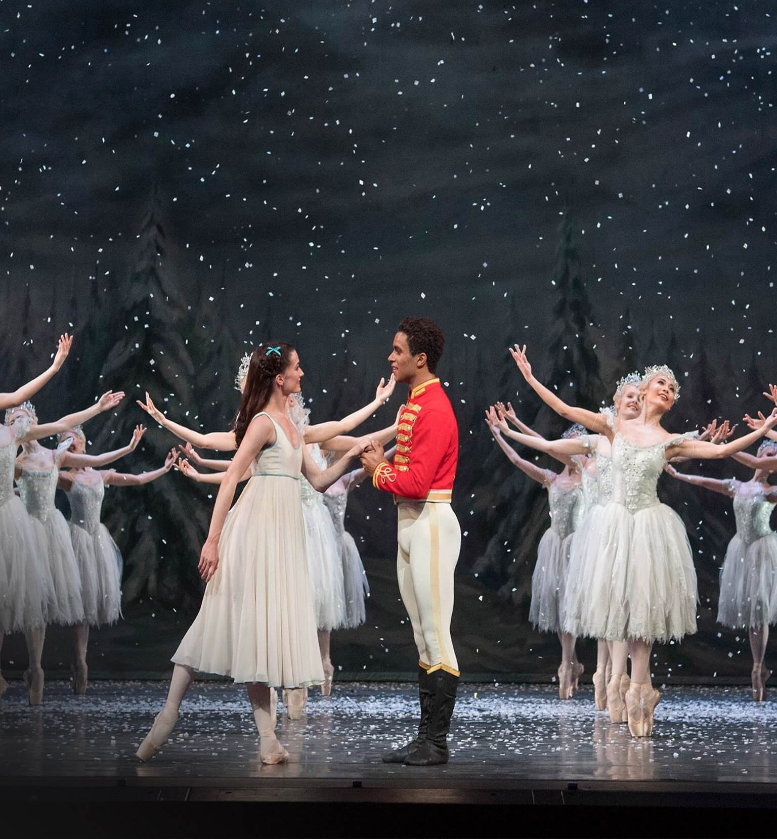 The Royal Ballet's The Nutcracker on stage with snowflake dancers