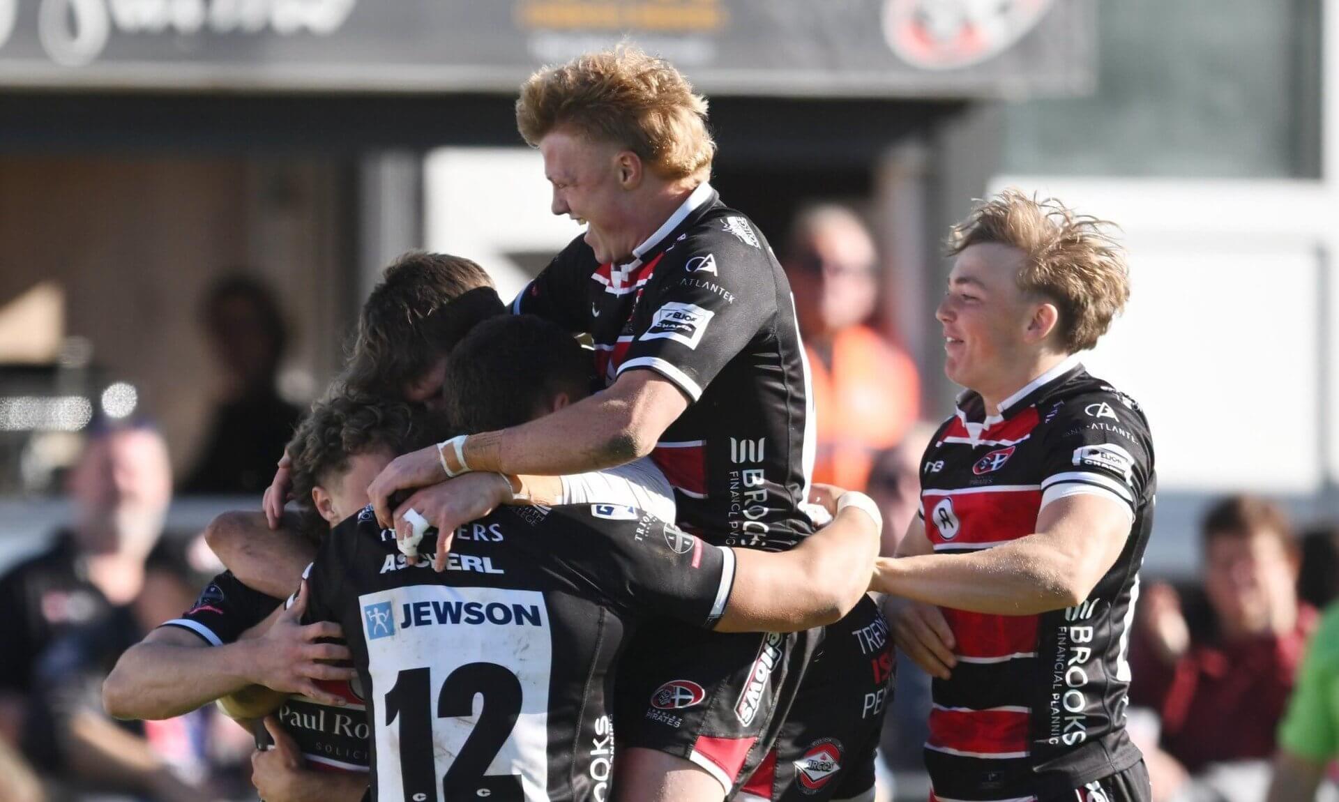 Cornish Pirates players celebrating a try against Chinnor at the Mennaye Field