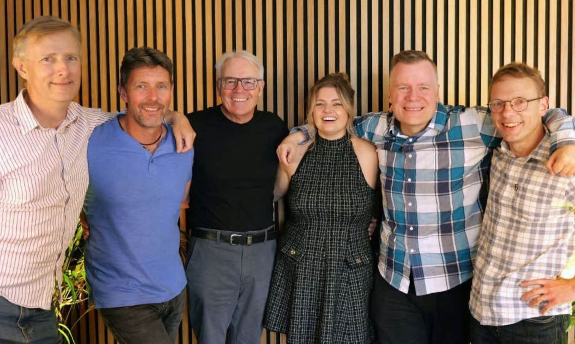 Six Rewind Radio Retro presenters standing together
