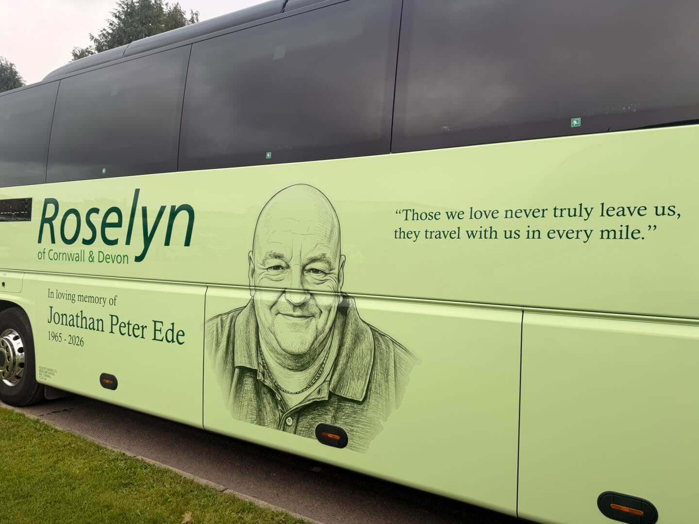 Portrait of Jonathan Ede and memorial quote on the side of a Roselyn coach