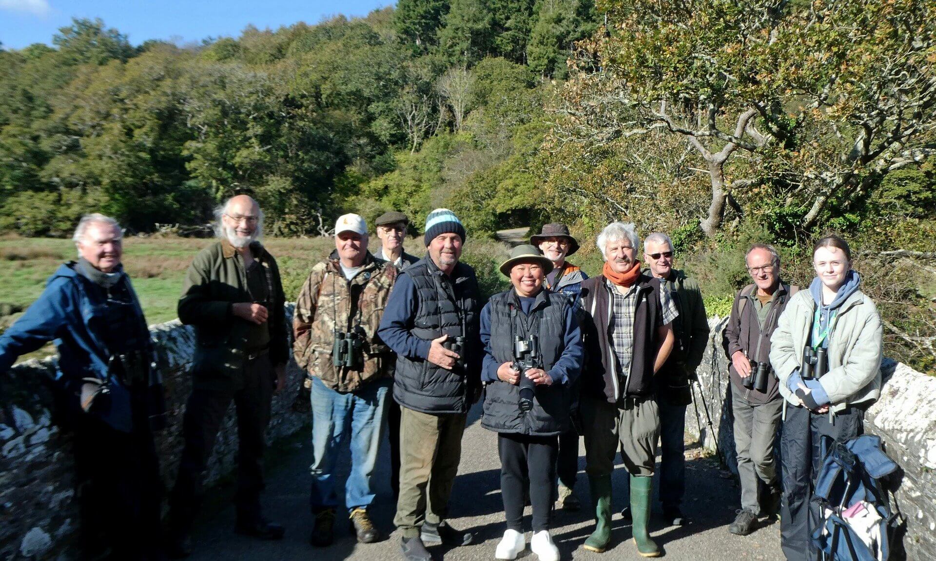 Connect with Nature birdwatching group on a stone bridge at Ruan Lanihorne