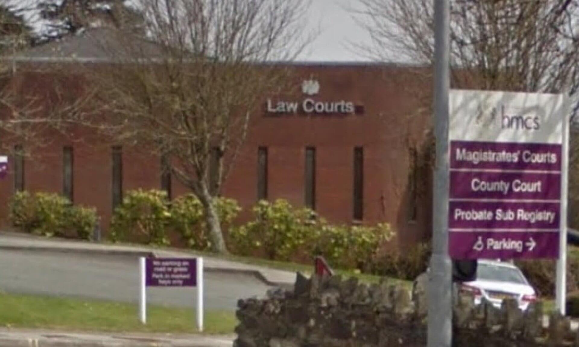 Law Courts building with signs for the Magistrates' Courts and County Court