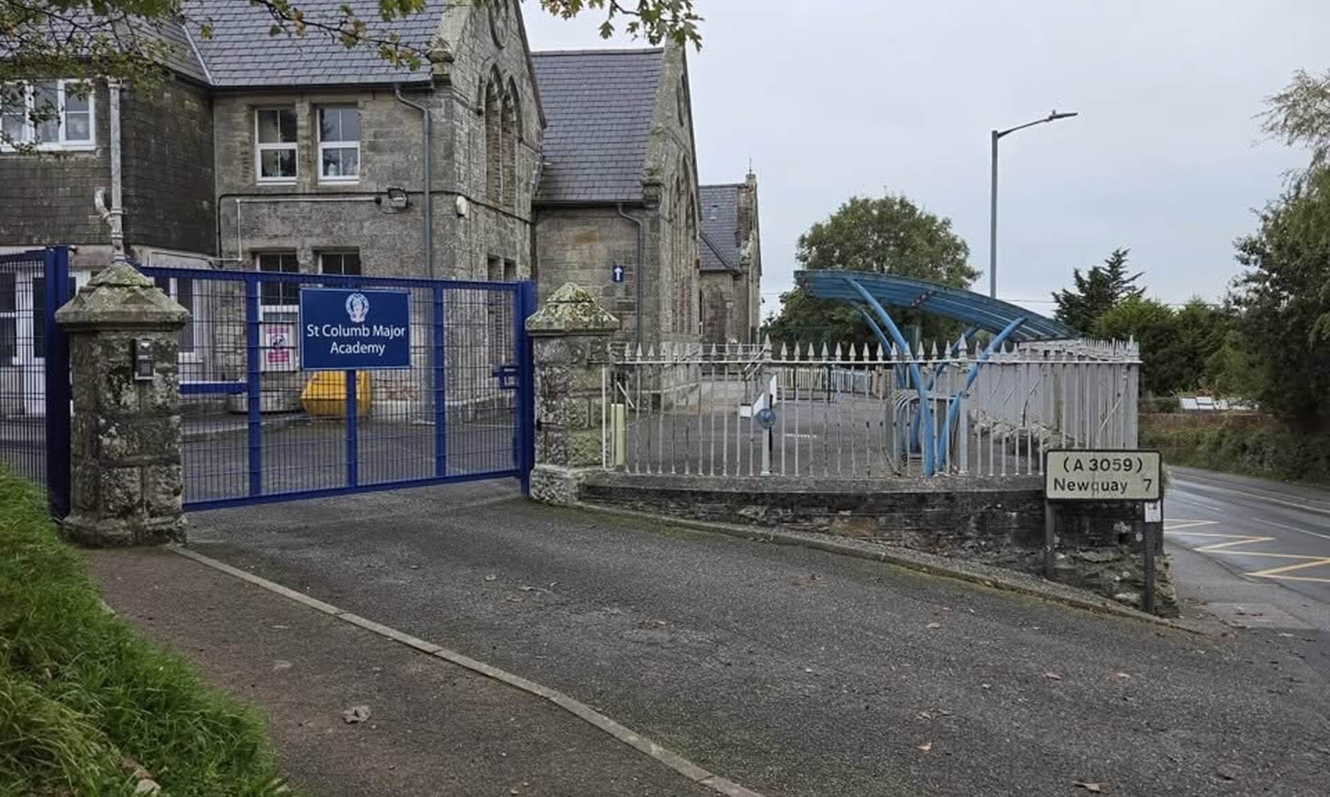 The gates of St Columb Major Academy beside the A3059