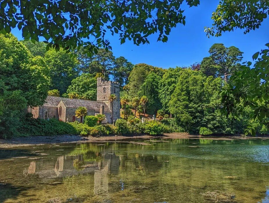 St Just-in-Roseland church reflected in the creek