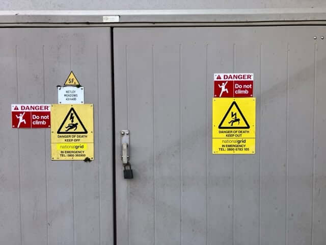 Danger of death and do not climb warning signs on substation doors