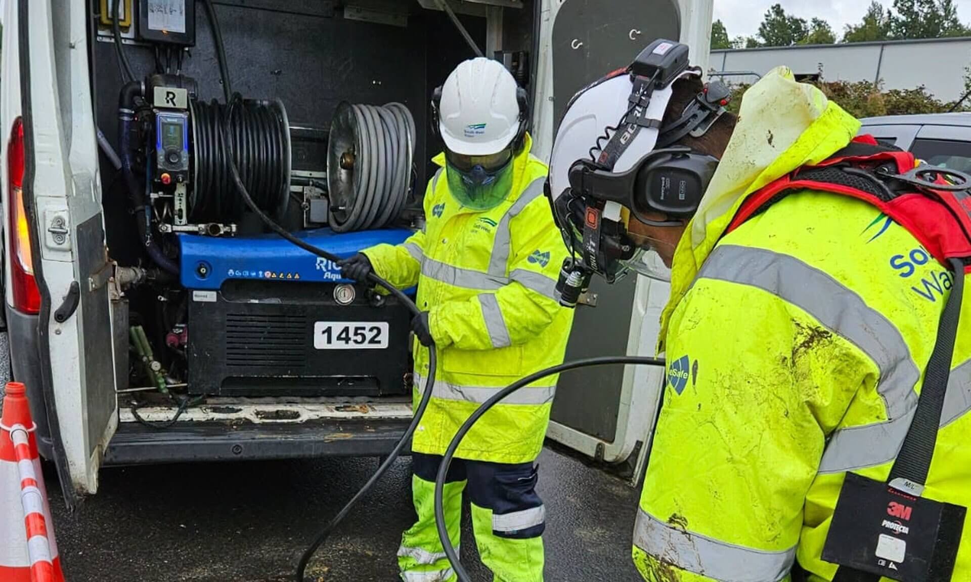 South West Water crew clearing a sewer blockage through an open manhole