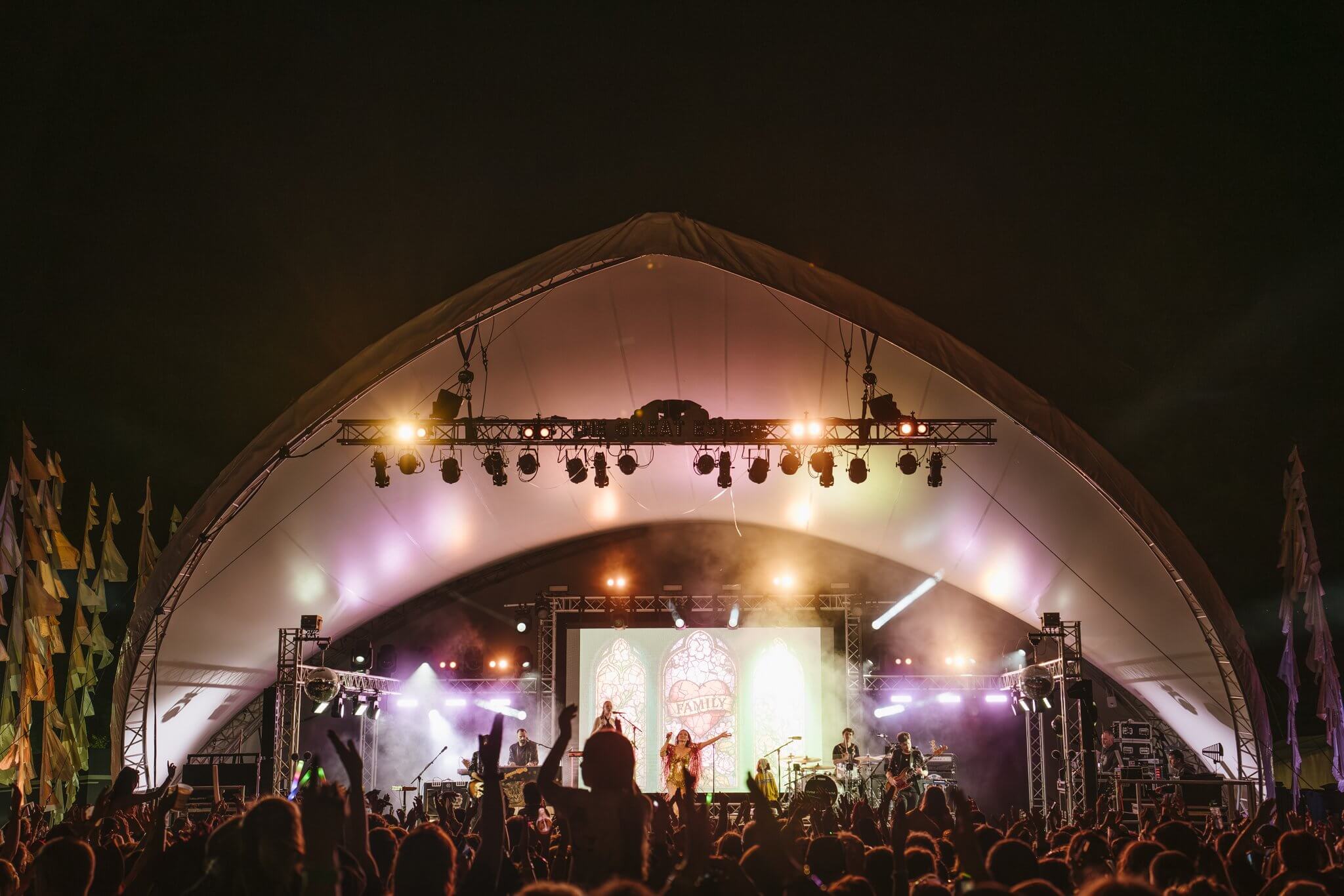 Crowd in front of the main stage at night at The Great Estate Festival, Scorrier