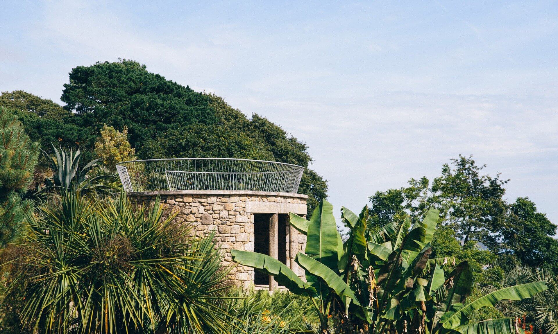 The Pagoda among palms and banana plants at Tremenheere Sculpture Gardens near Penzance