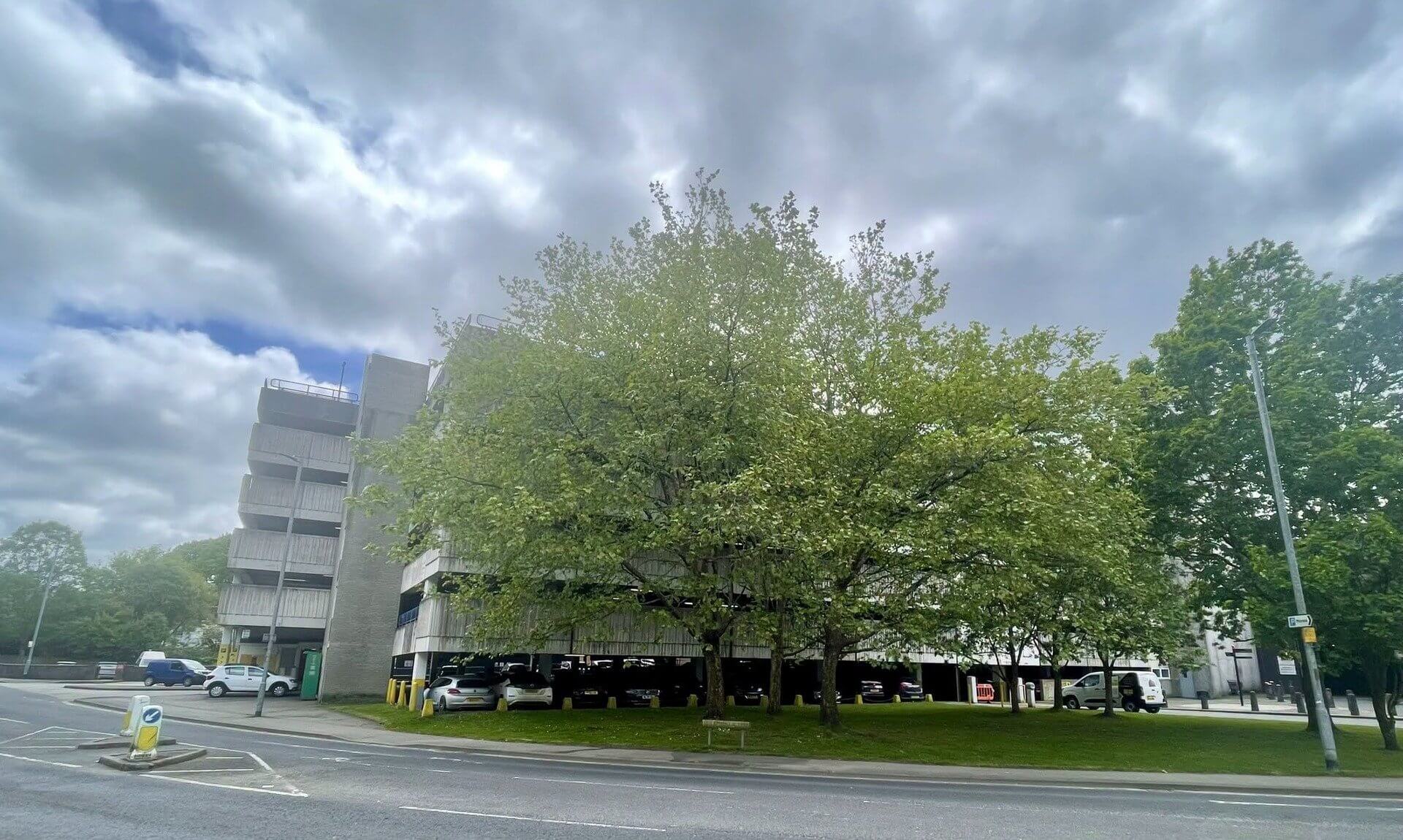 Multi-storey car park in Truro behind trees