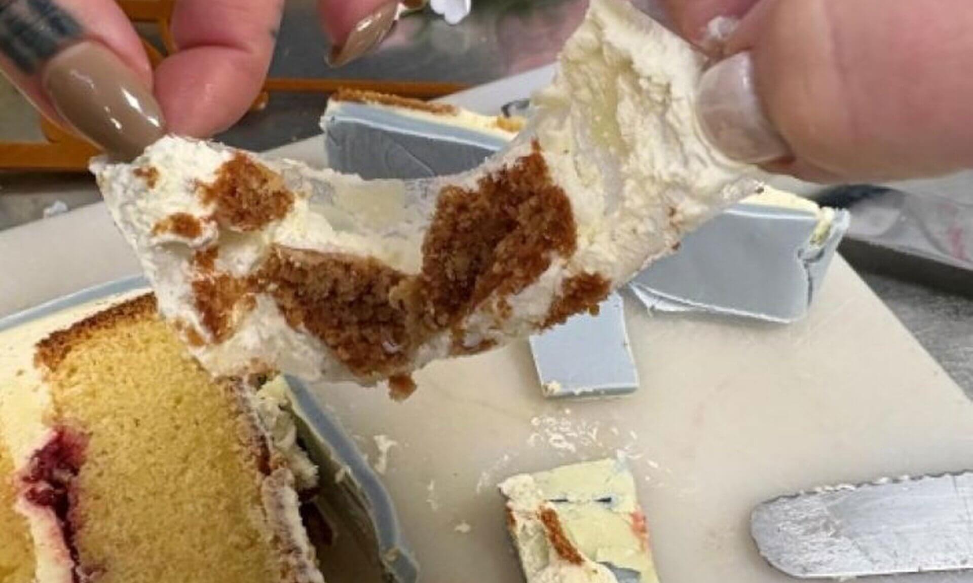 Plastic sheet pulled from between the icing layers of a wedding cake