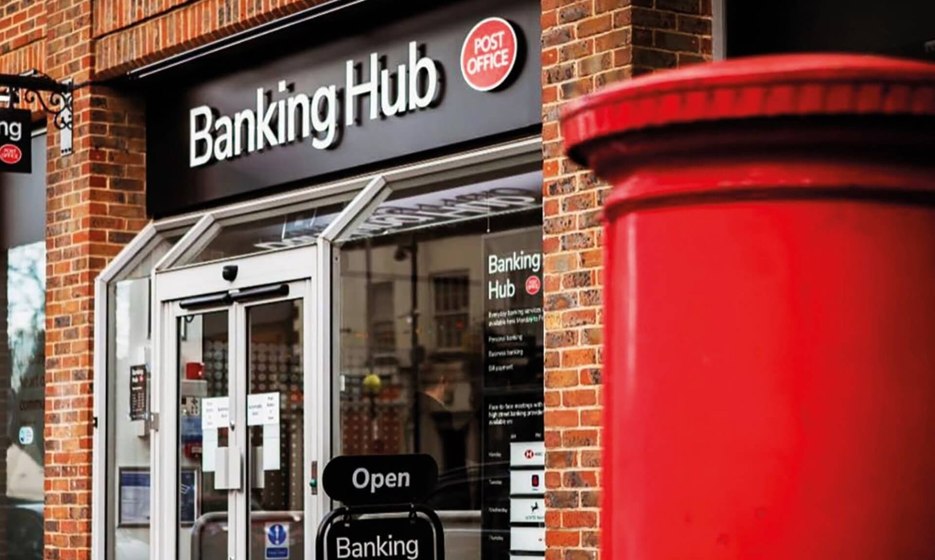 Post Office Banking Hub shopfront with a red postbox outside