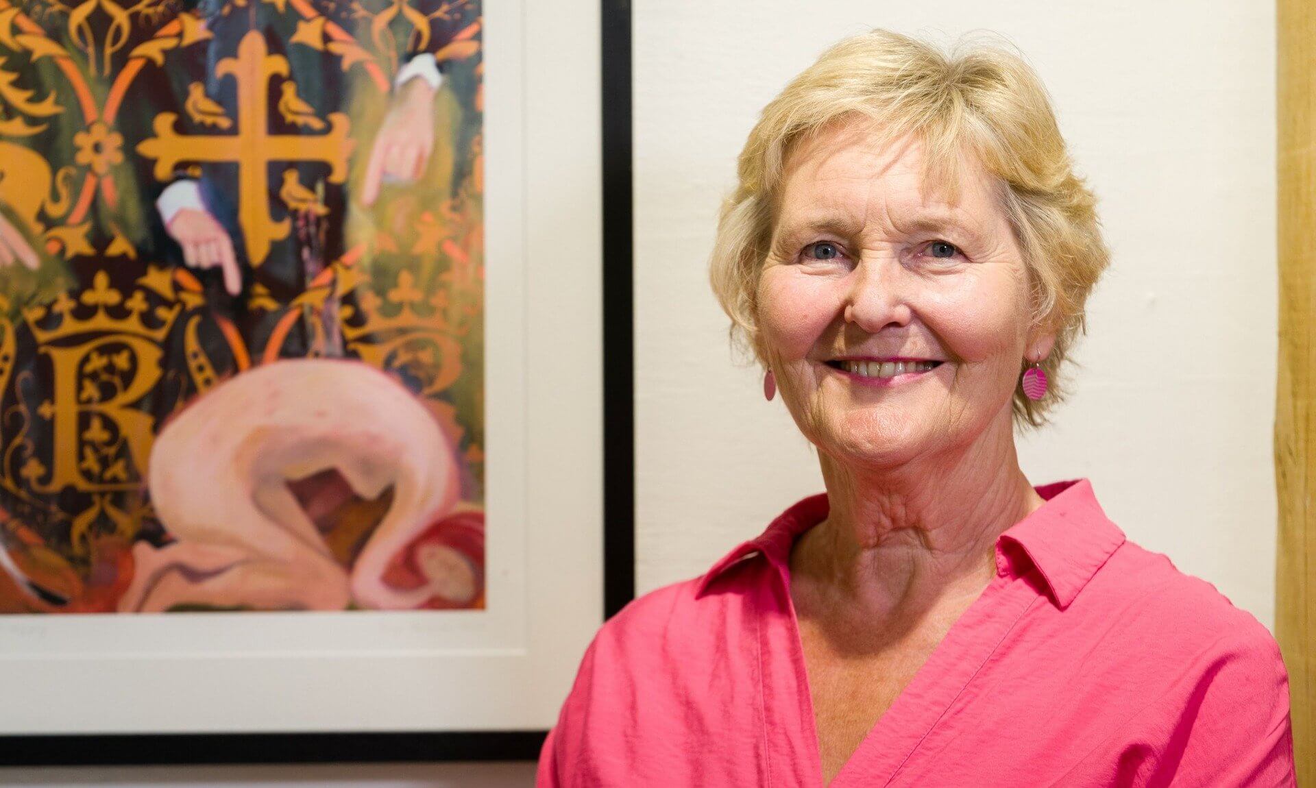 Artist Terrye Teverson beside one of her works