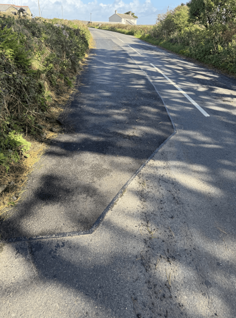 The same road near Penzance after resurfacing along its edge