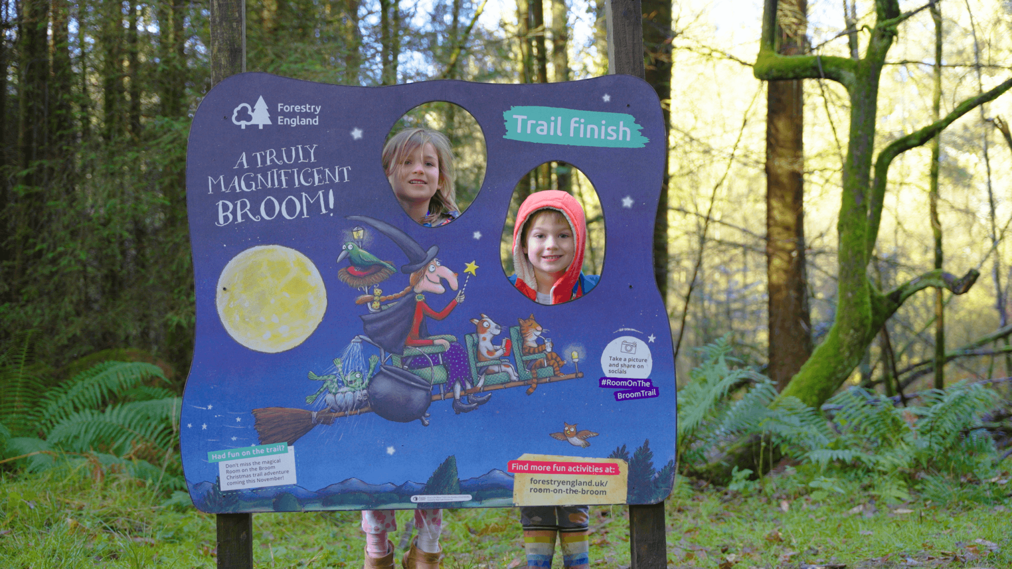 Children at the Room on the Broom trail finish board