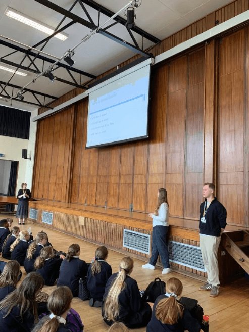 Speakers at the front of the hall during an assembly at Launceston College