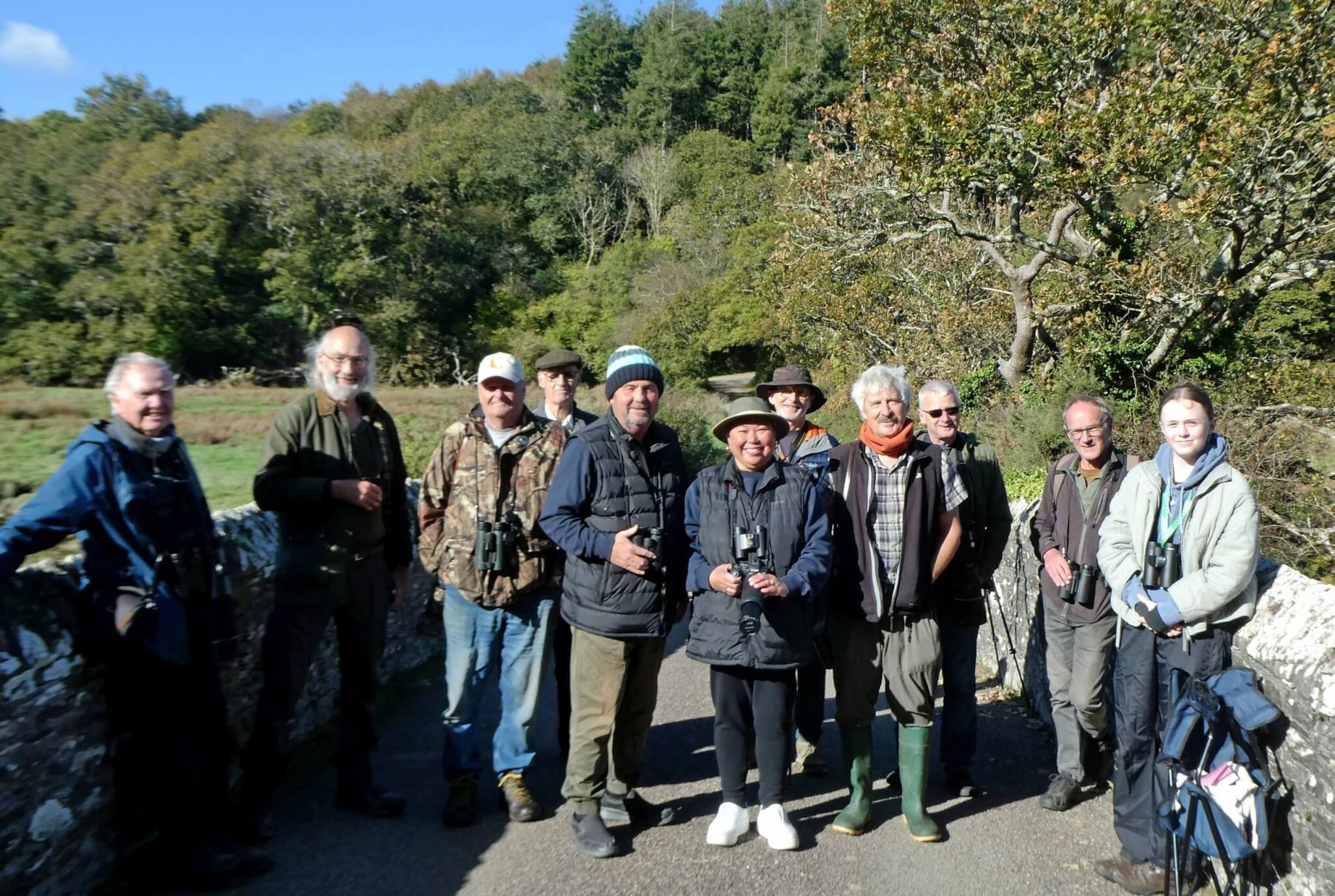Connect with Nature birdwatching group on a stone bridge at Ruan Lanihorne