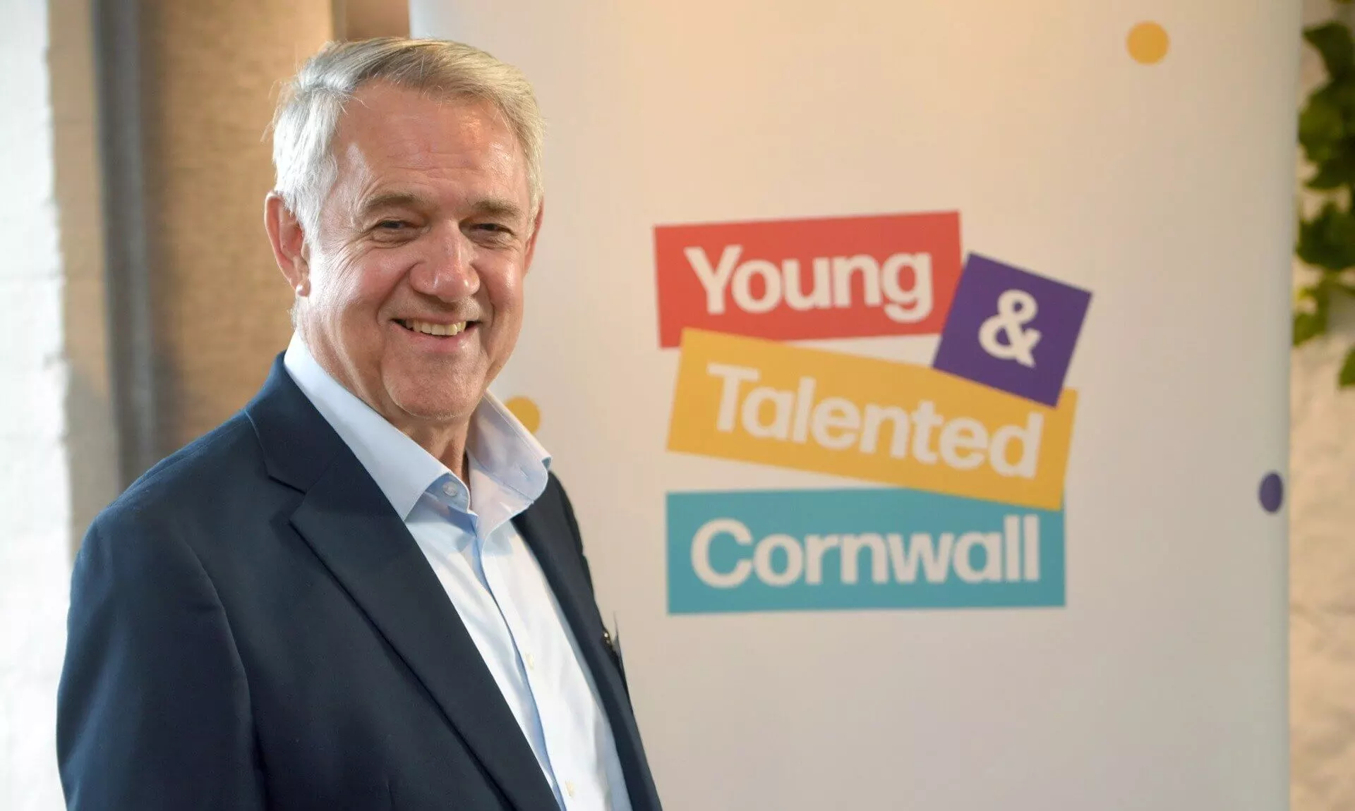 Don Turvey of Cornish Metals beside a Young & Talented Cornwall banner