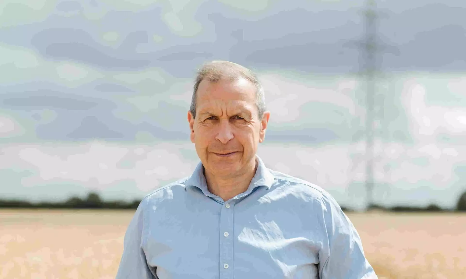 Gavin Lane, President of the Country Land and Business Association, standing in a wheat field