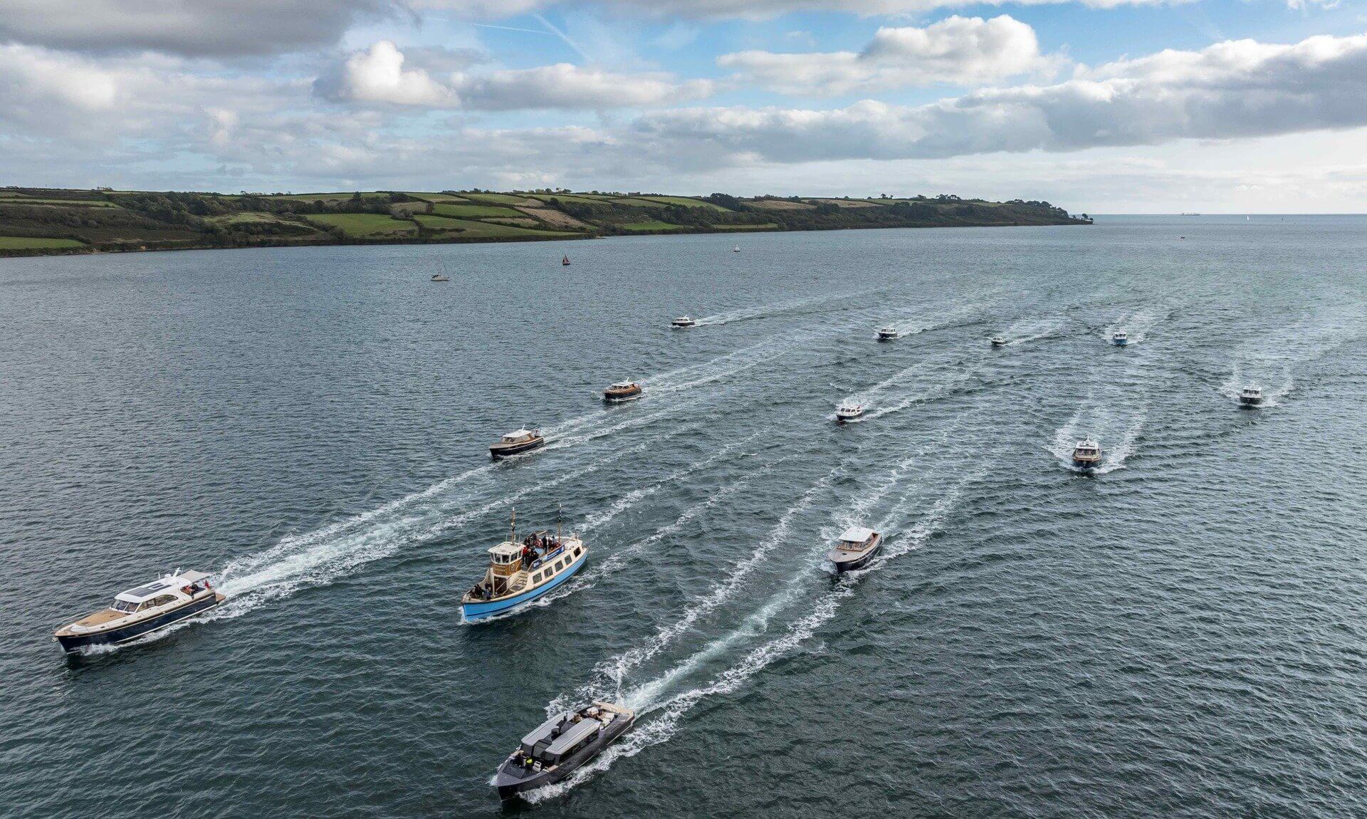Aerial view of a flotilla of Cockwells boats on the Carrick Roads, Falmouth