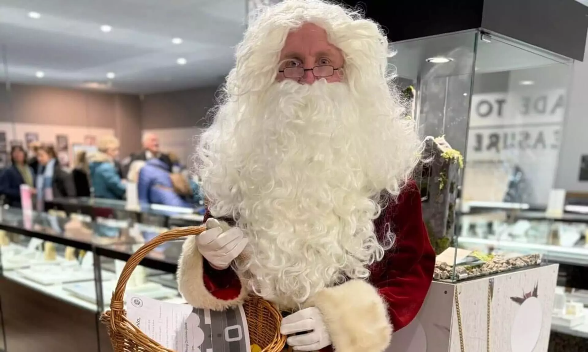 Santa holding a wicker basket at Cornwall Gold's Christmas Market