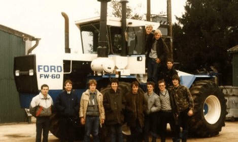 Duchy College's first agriculture students beside a tractor in 1986