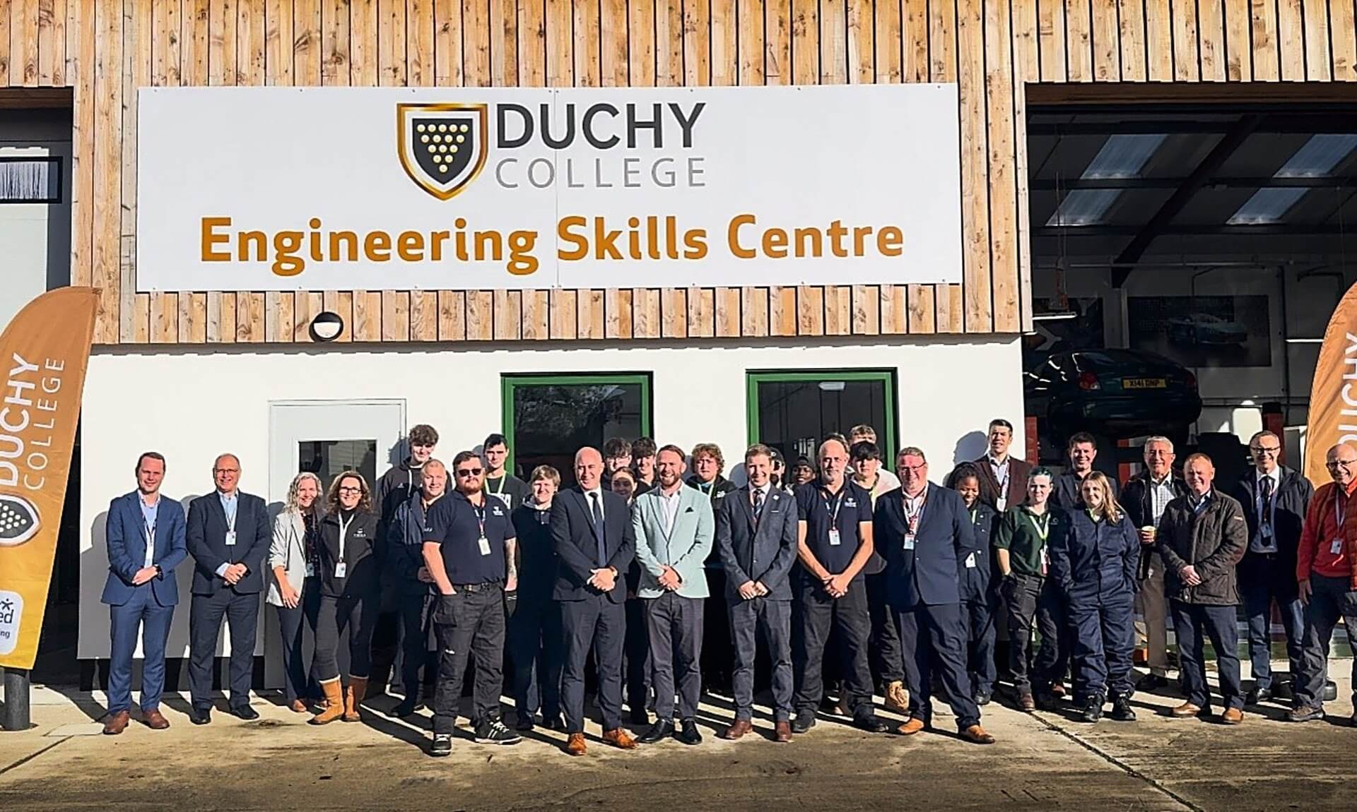 Staff, students and guests outside the Duchy College Engineering Skills Centre at Stoke Climsland