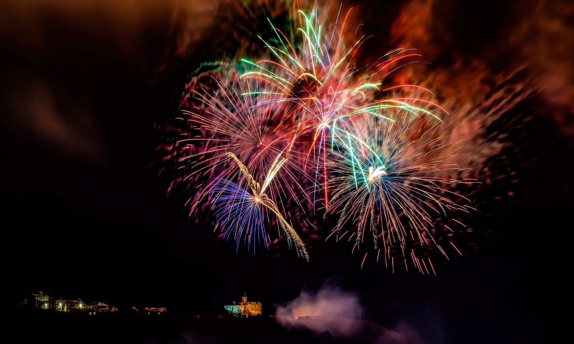 Fireworks bursting over Pendennis Castle in Falmouth at night