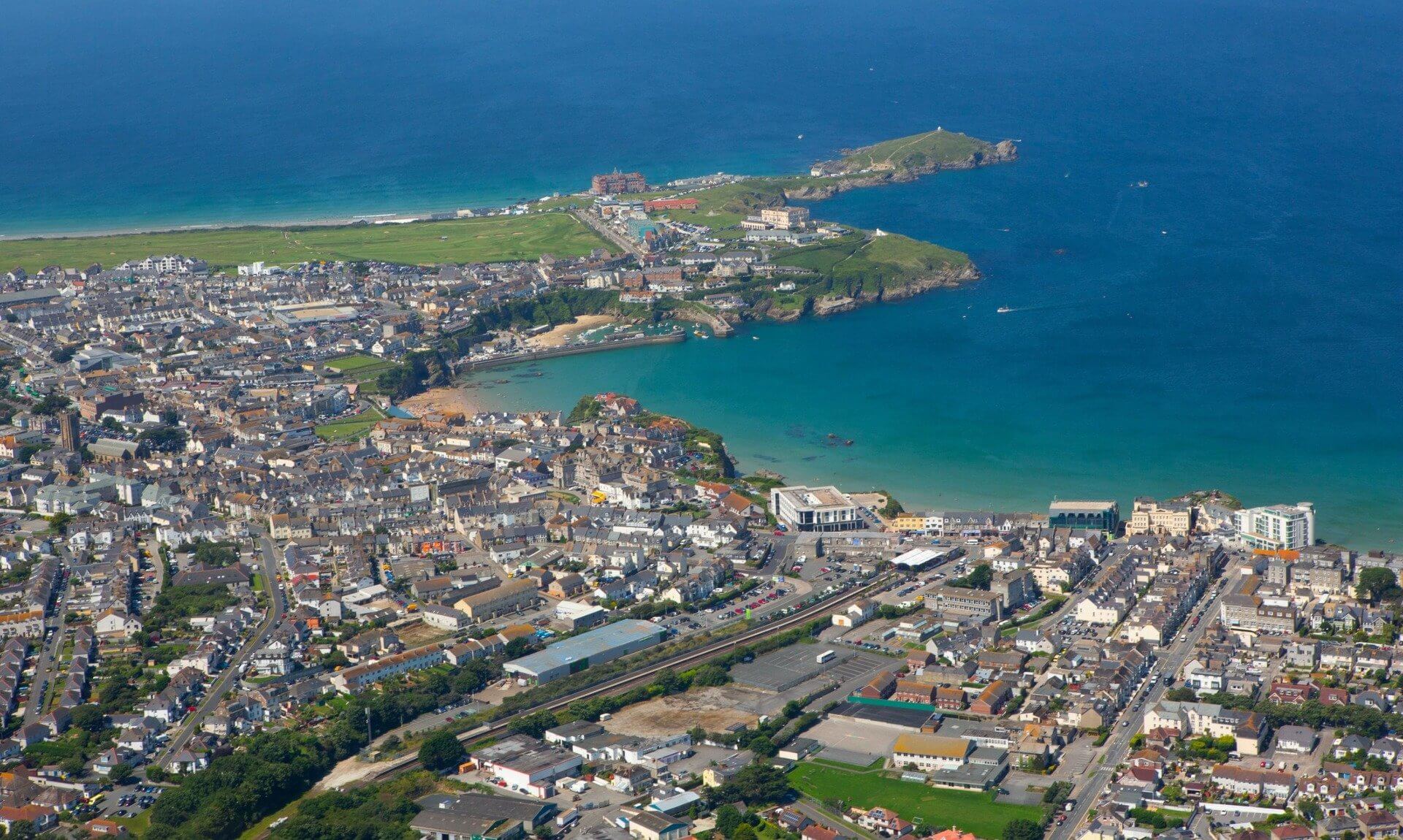 Aerial view of Newquay town, harbour and headland
