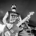 Bass player on stage at The Great Estate Festival