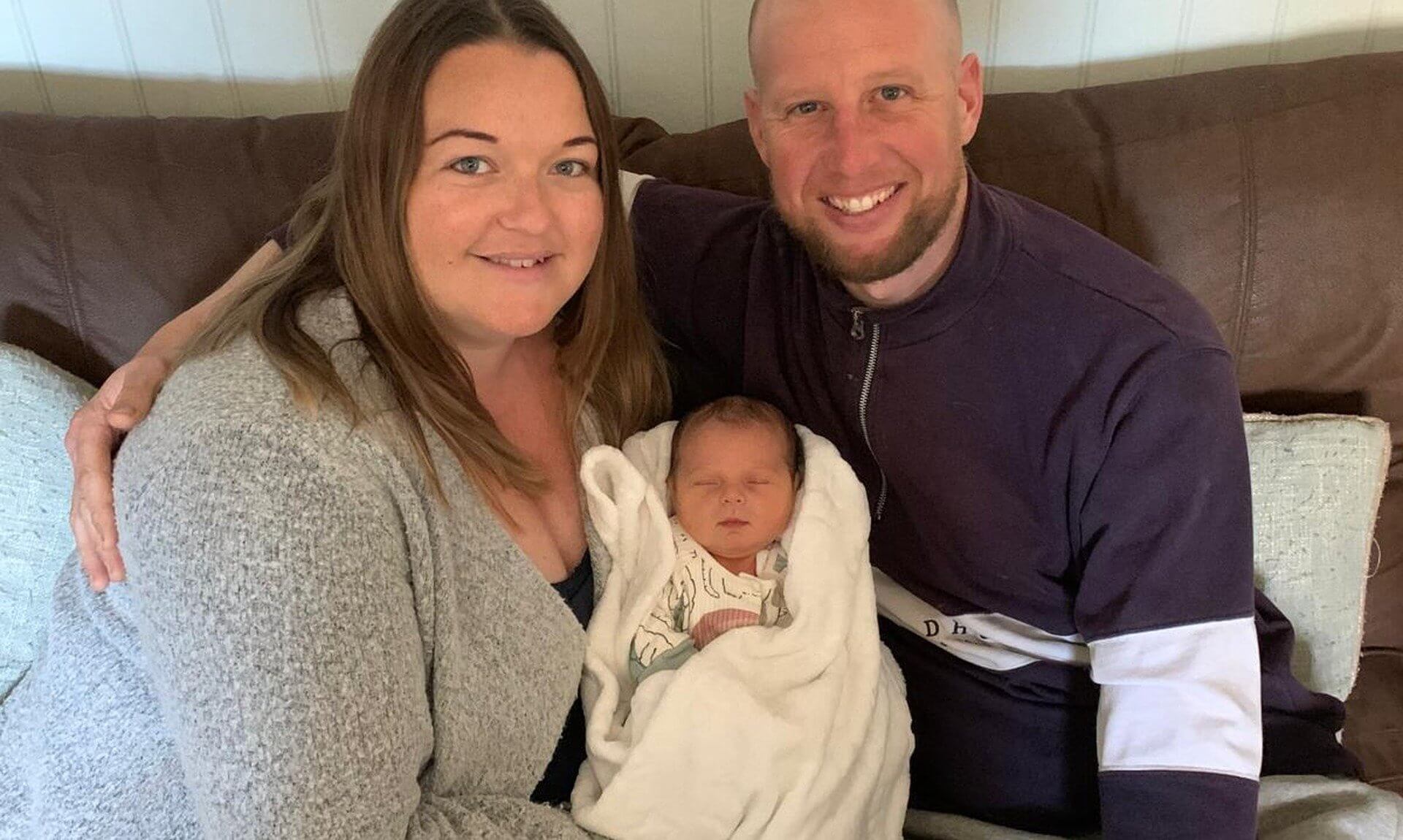 Sarah Doolin and Craig Pollard with their newborn son Ezrah at home
