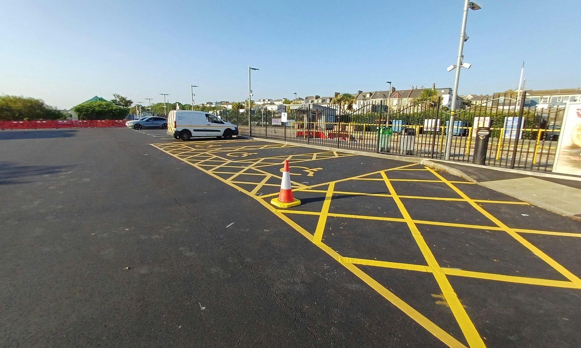 Newly resurfaced Newquay Railway Station car park with yellow hatched disabled bays