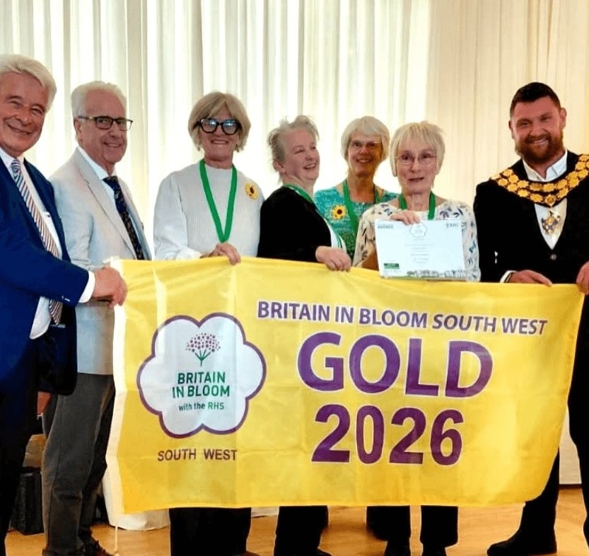 Group holding the Britain in Bloom South West Gold 2026 banner and certificate at the awards
