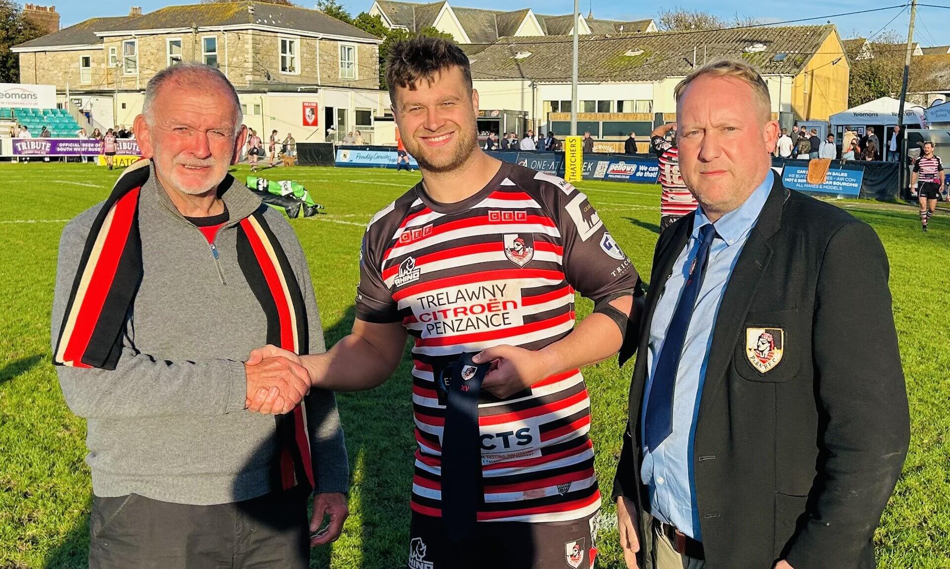Nick Nowell receiving his 100 games Merit Tie at the Mennaye Field