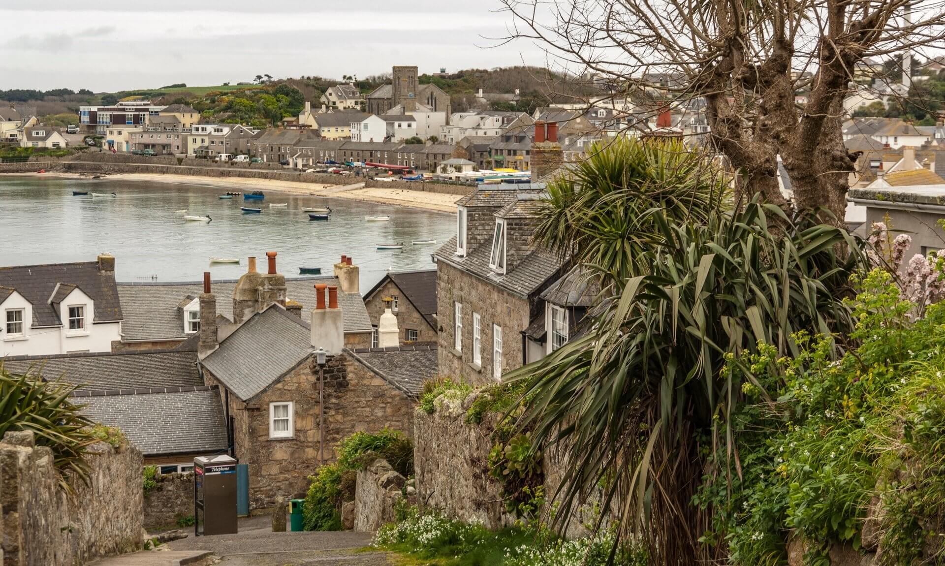 Stone cottages and rooftops above the harbour at Hugh Town, St Mary's, Isles of Scilly