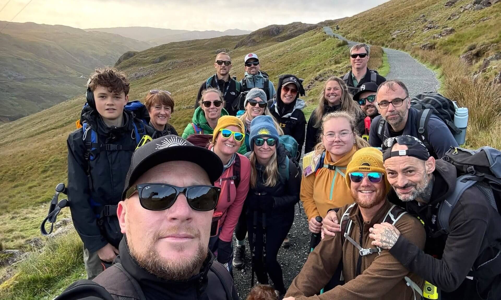 Sunrise Cornwall CIC Three Peaks team selfie on a mountain path