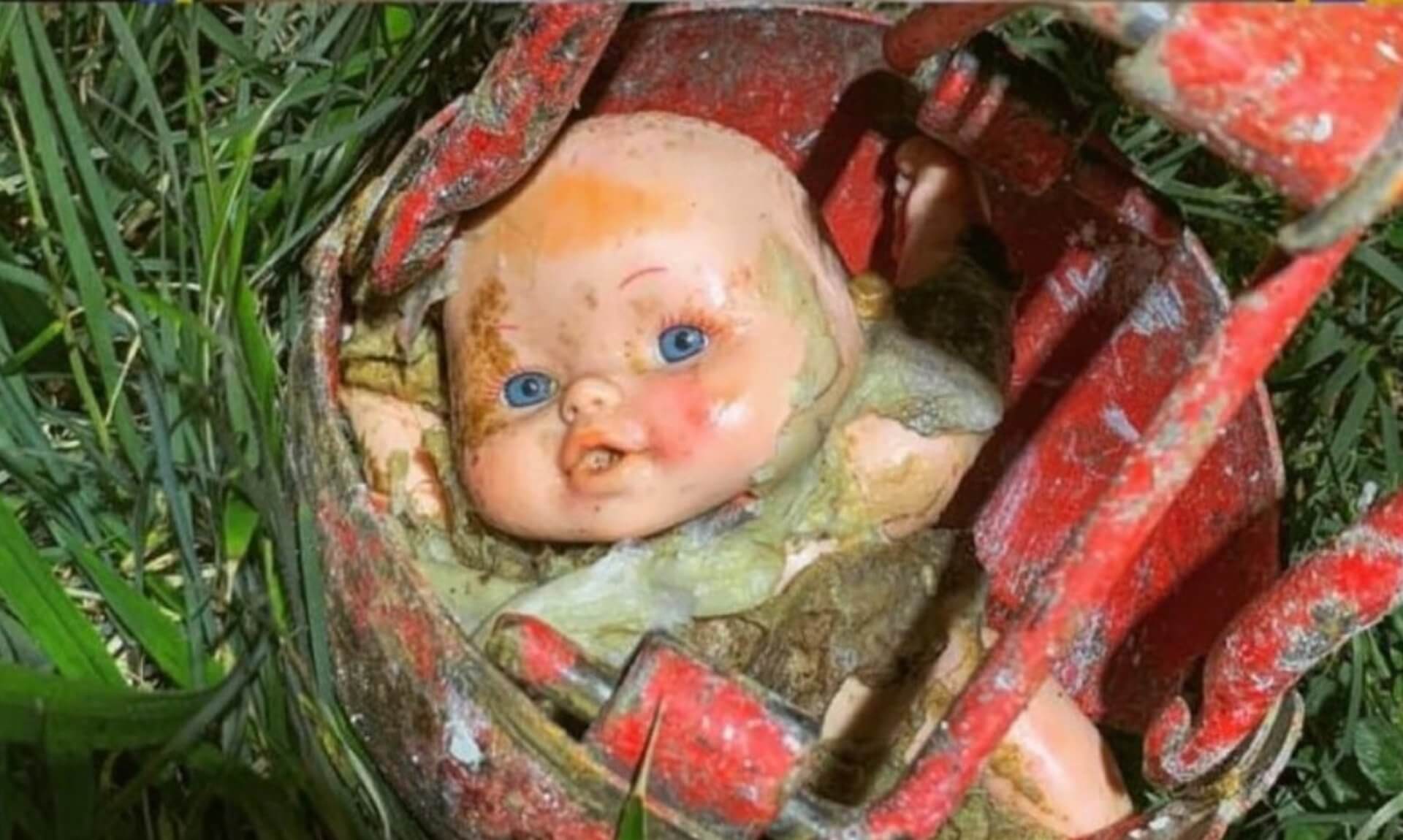 Mud-covered baby doll found blocking a sewer in Exmouth