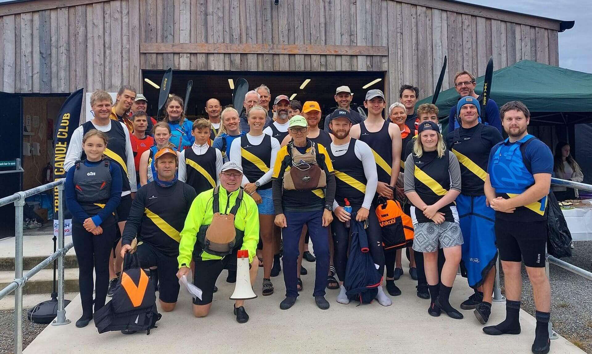 Truro Canoe Racing Club members outside the club house at Boscawen Park